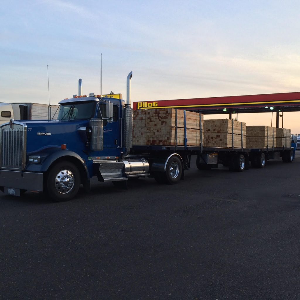 Kenworth double trailers in compliance with 80,000 pounds GVW laws.