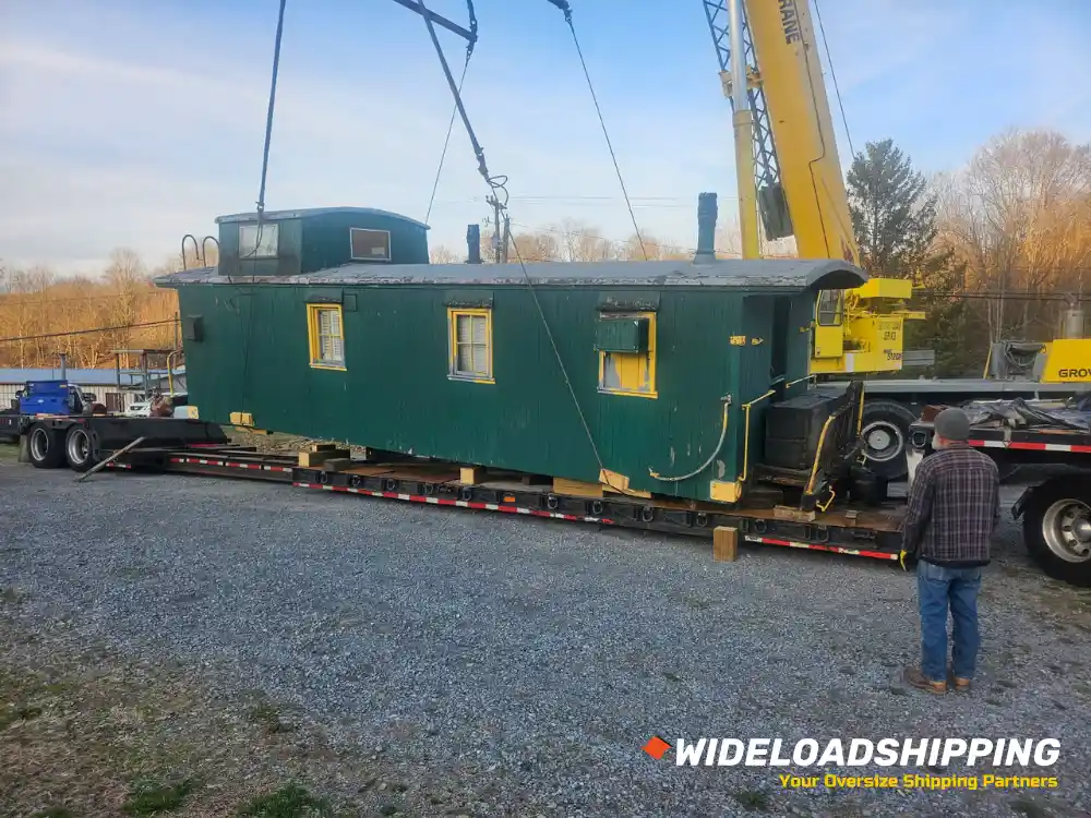 Converted train car loaded by crane