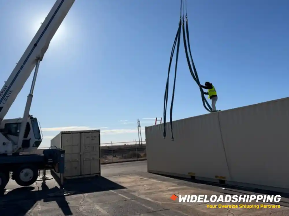 Five shipping containers being lifted by crane service in Austin, TX